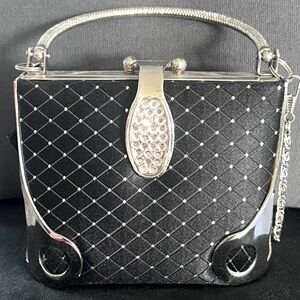 Small silver, black & rhinestone hand purse.  Lock tab. Silver shoulder strap.